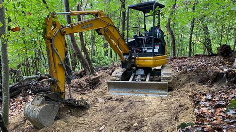 mini excavator trail building